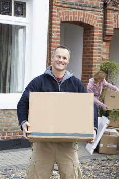 Removals van and moving team in a Fulham residential street