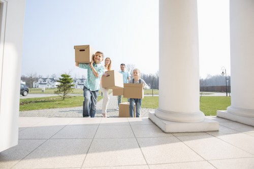 Man and van loading furniture in a Fulham street