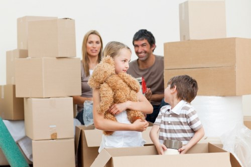 Local removals team carrying items from a flat with stairs in Fulham